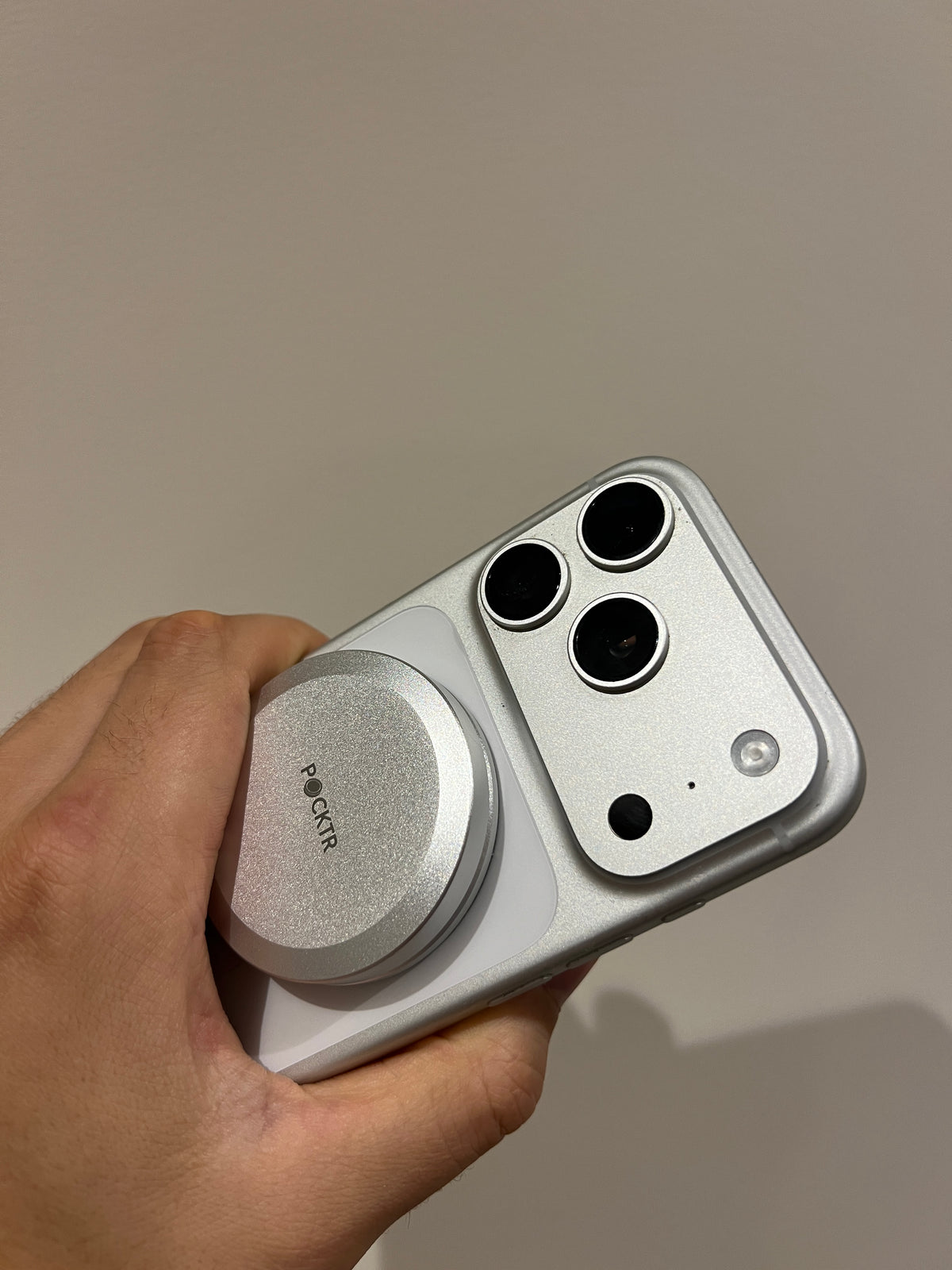 Snaps to your phone. Stays there.